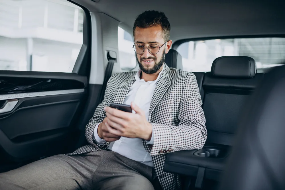 Business man sitting back sit car using tablet